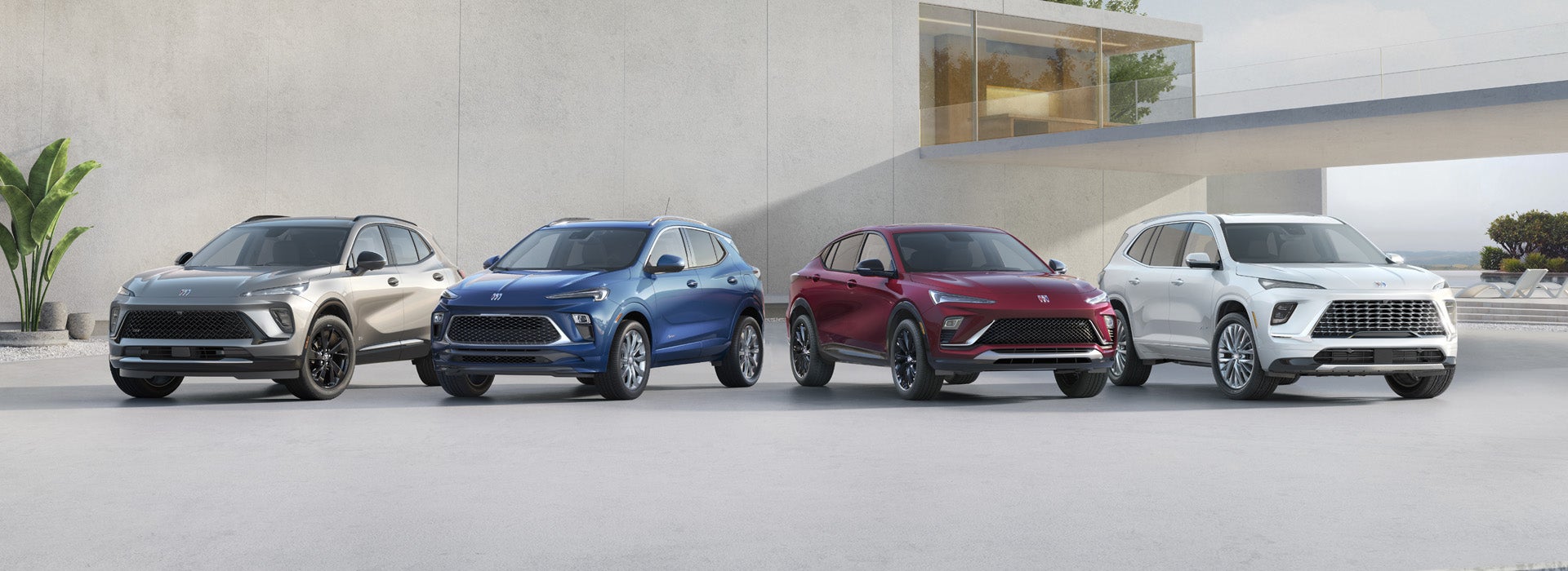 4 Buick vehicles parked outside an apartment